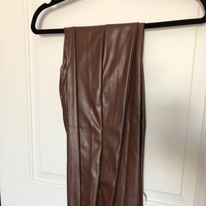 High-waist brown leather pants with slit